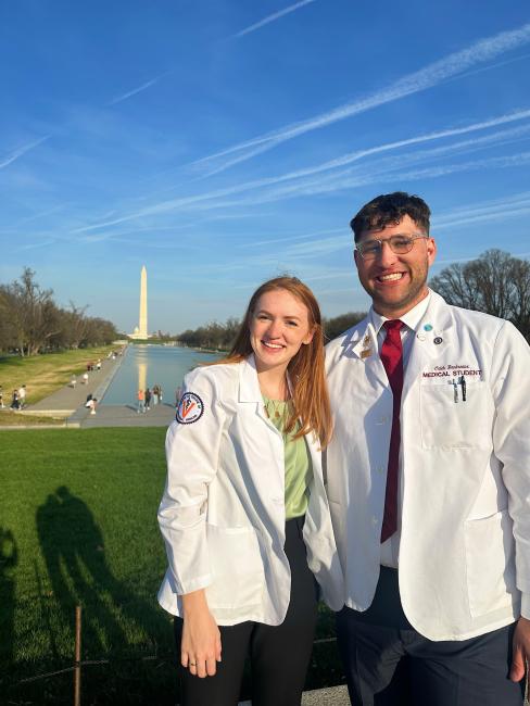 Caleb Boudreaux and fellow classmate standing in front of the Washington Monument
