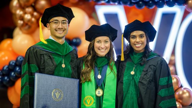 VCOM-Auburn class of 2026 graduates in regalia smiling