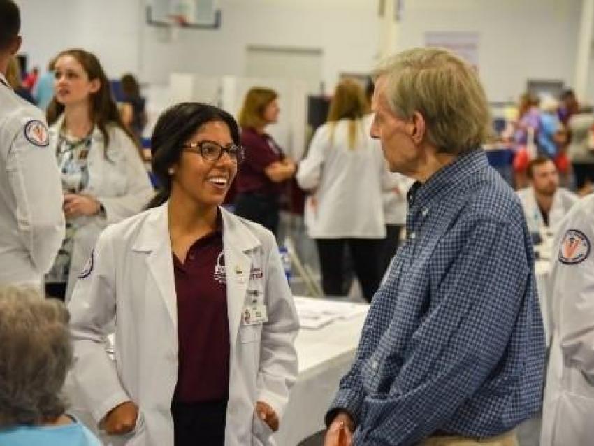 Student with outreach patient