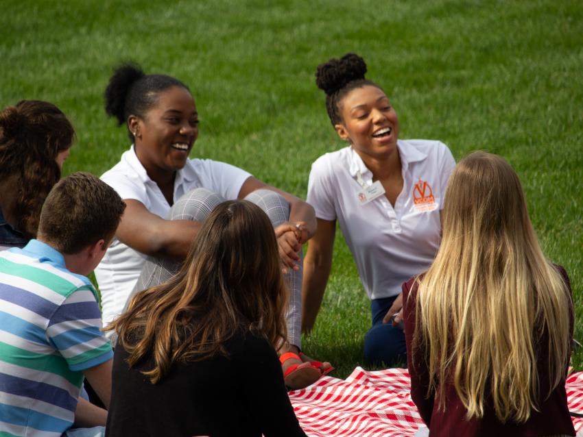 students spending time together on the VCOM lawn