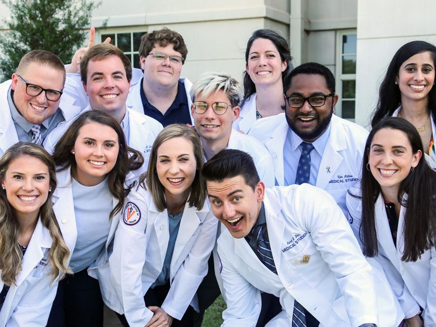 Auburn students in white coat fun photo