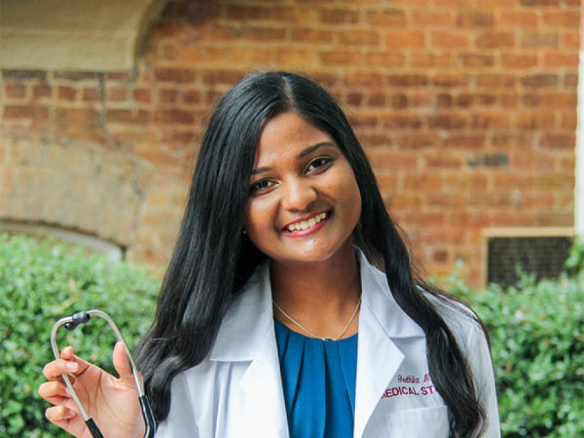 Carolinas student in white coat