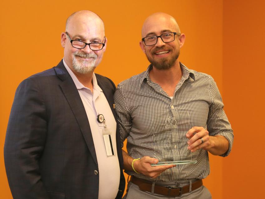 Joshua Hollingsworth, PharmD, PhD with award