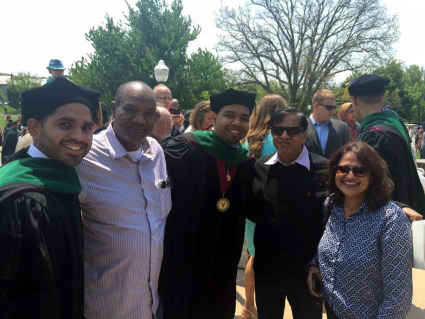 Amar and Sonul posing with family after VCOM graduation