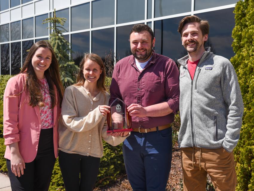 Dr. Bhagtani's students show off her Researcher of the Year Award