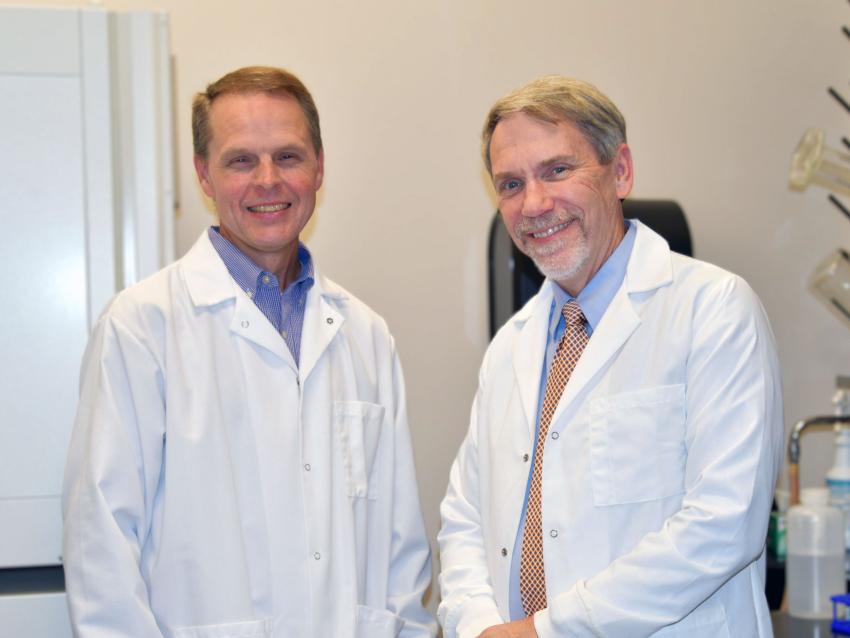 Joseph W. Brewer, PhD standing with Robert L. Judd, PhD