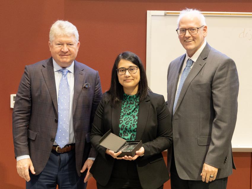 Dr Brolinson and Dean Sanders with Research Day winner