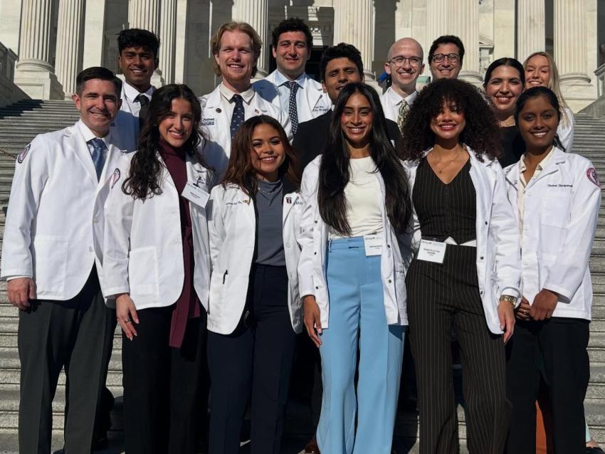 VCOM-Auburn students in white coats smiling