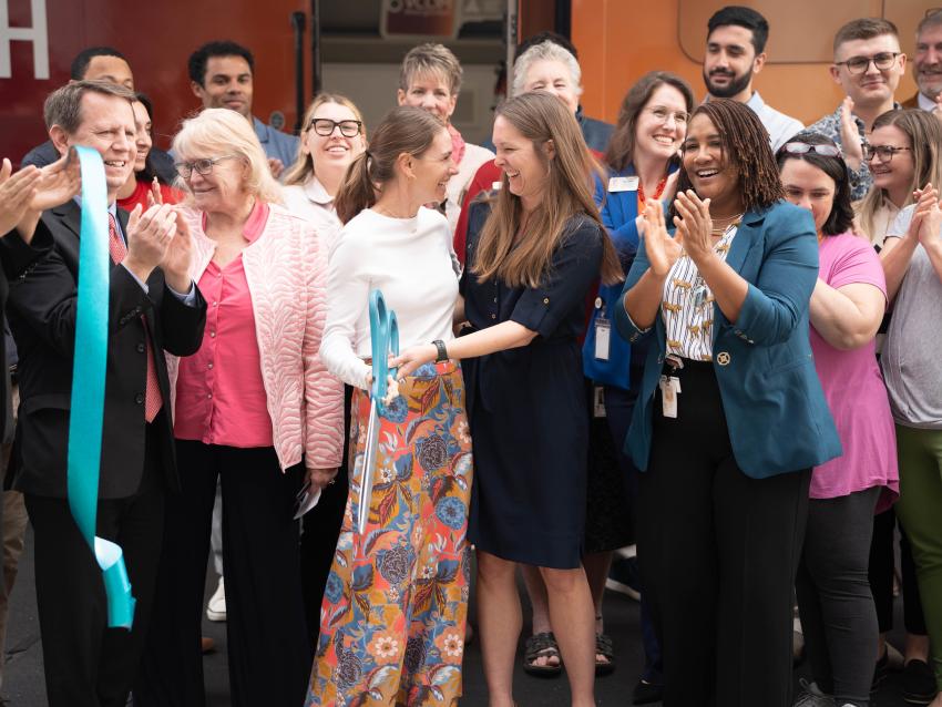 Smiling group after ribbon cutting ceremony