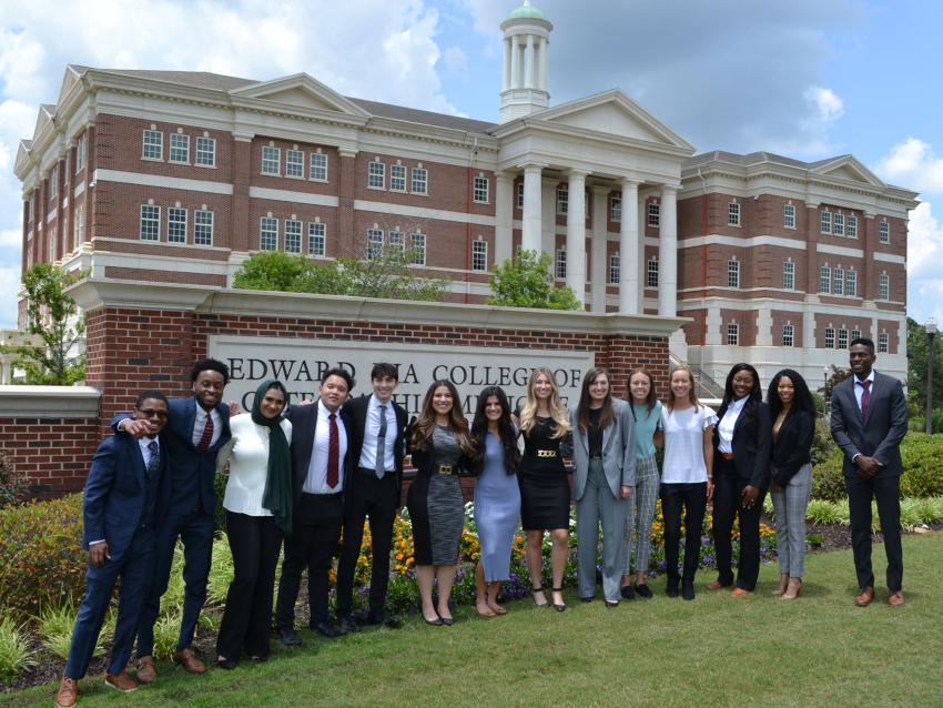 MHSA students standing in front of VCOM-Auburn