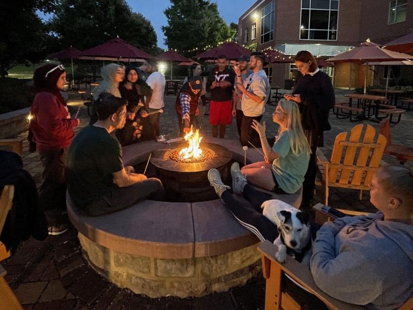 VCOM Student Advocate Association (SAA) members roasting marshmallows