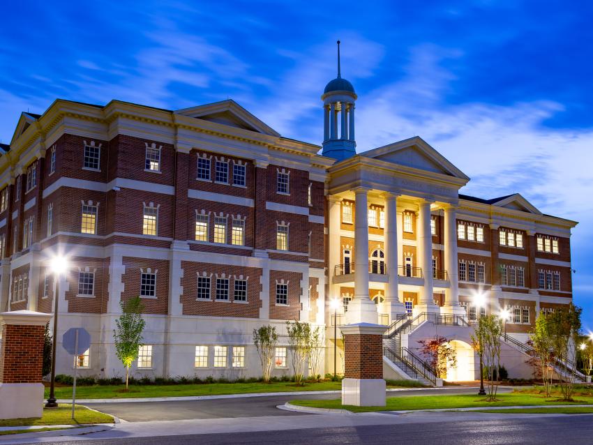 VCOM-Louisiana campus building at dusk