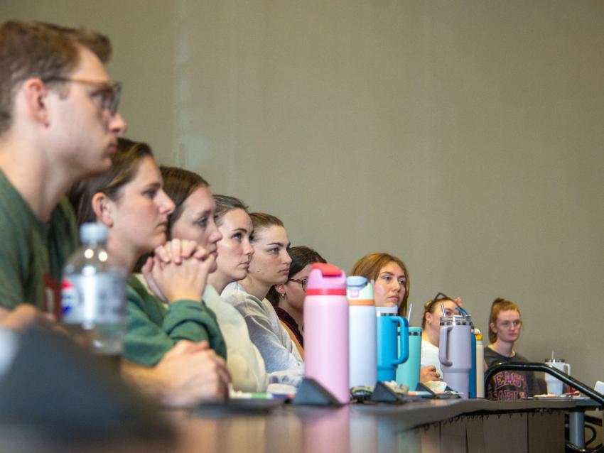 A row of students sitting in class