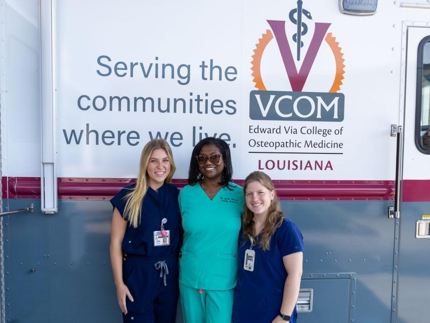 OMS IV students Savannah Collins, left, and Holly Jarkzynka, right, join Jonah Flowers, DO, in preparing to serve seniors in Northeast Louisiana 