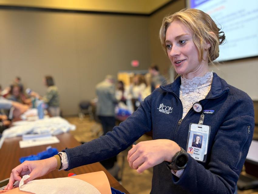 Person working and learning during the stop the bleed training session