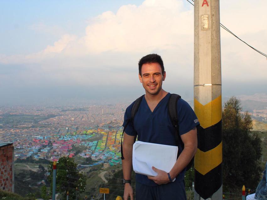 Robert Eysler on a mission trip with a view of the city behind him