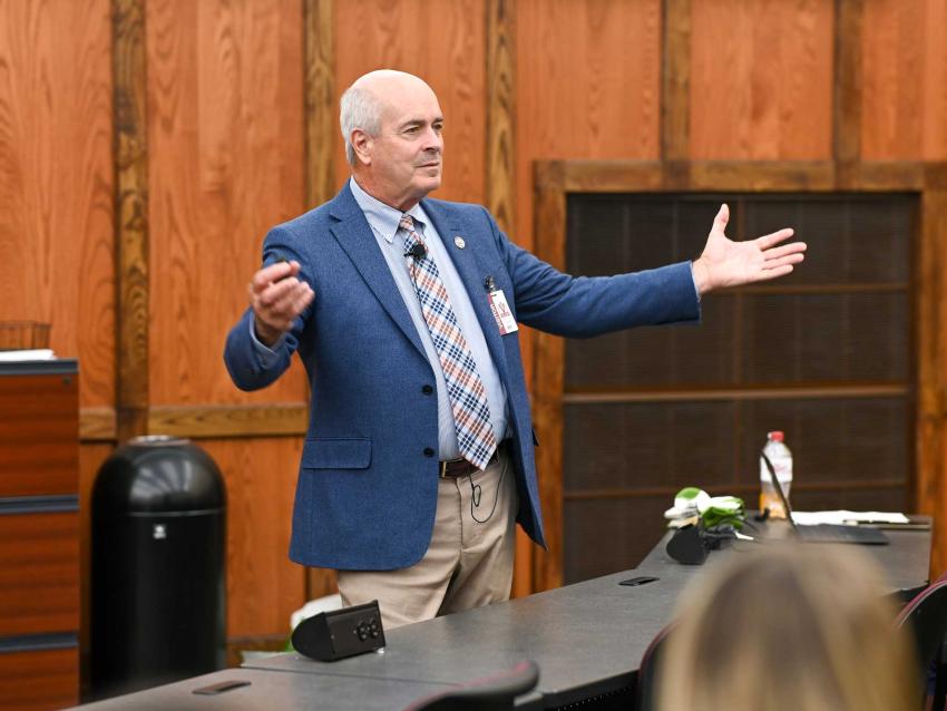 John R. Gimpel, DO, MEd speaking in front of students