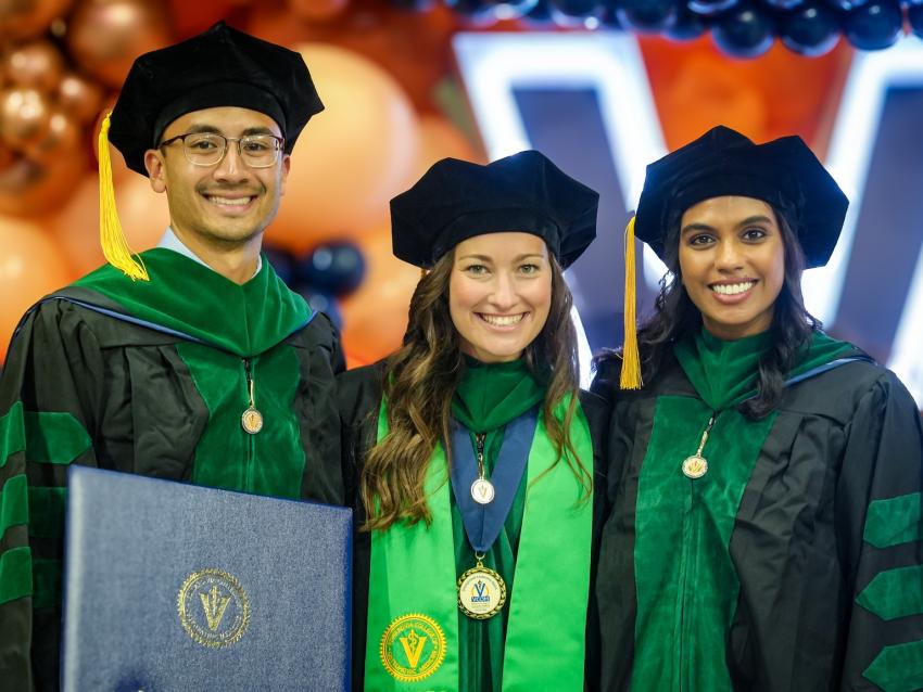 VCOM-Auburn class of 2026 graduates in regalia smiling