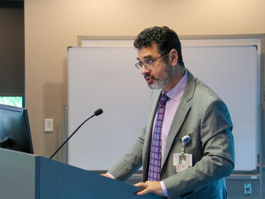 Hanna Sahhar, MD speaking at a podium