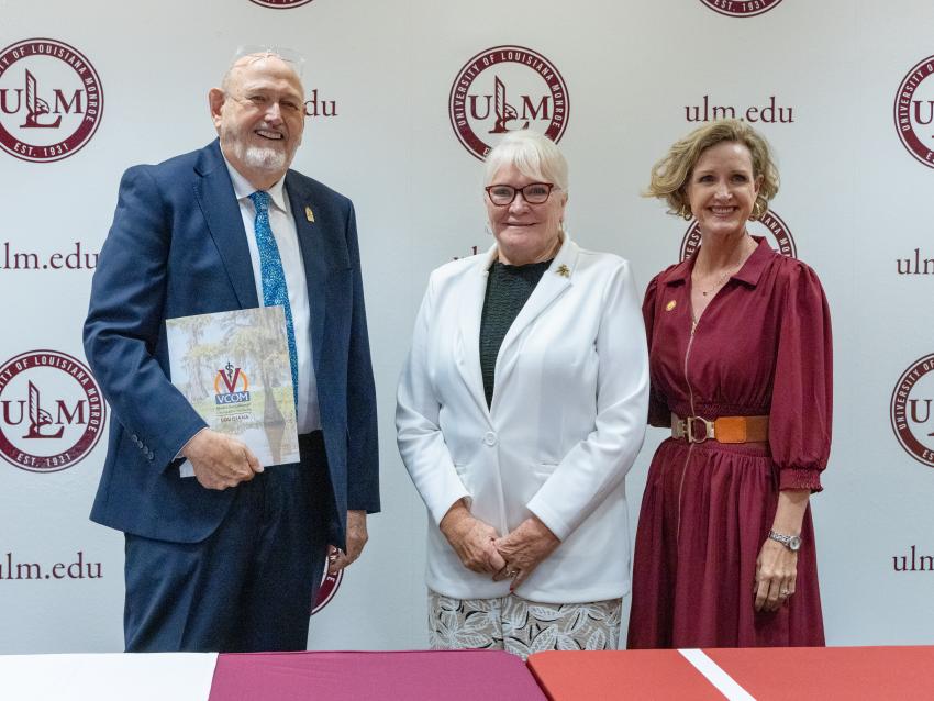 Ray Morrison, Dixie Tooke-Rawlins, and Carrie L. Castille smiling