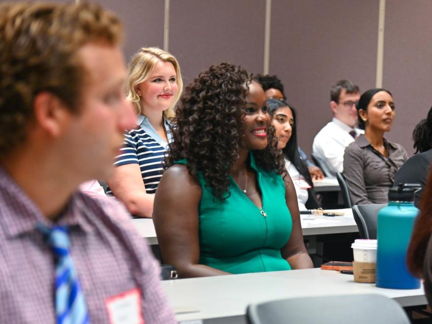 Student smiling in a classroom