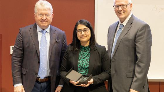 Dr Brolinson and Dean Sanders with Research Day winner