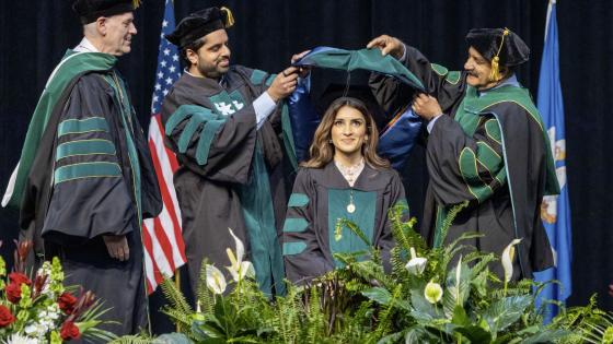 VCOM-Louisiana student being hooded by her family of doctors