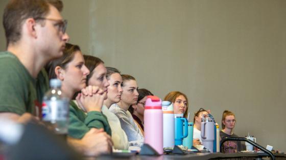 A row of students sitting in class