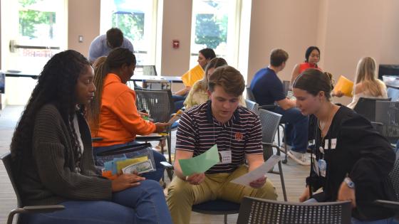 VCOM-Auburn students sitting in a circle talking