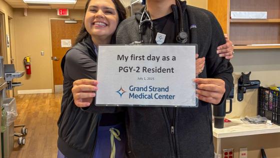 Trey Skains holding up his hospital match sign