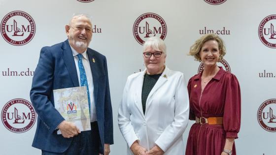 Ray Morrison, Dixie Tooke-Rawlins, and Carrie L. Castille smiling
