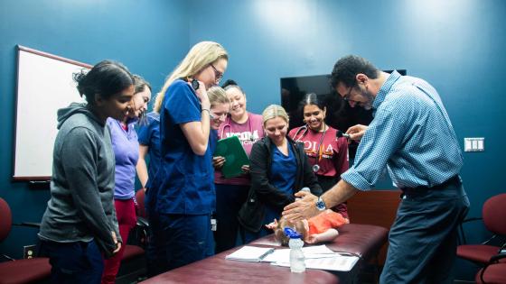 Dr. Sahhar with students during a pediatric bootcamp