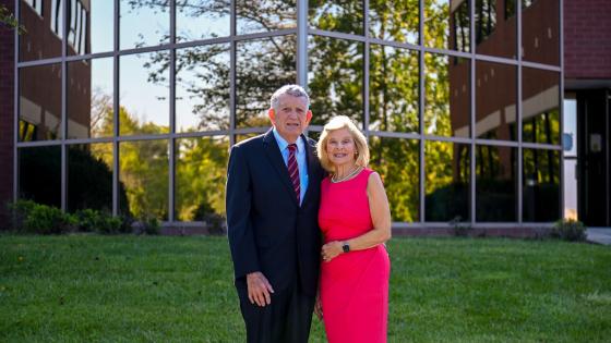 H. Pat and Nancy E. Artis standing in front of the New Health Sciences Education Building